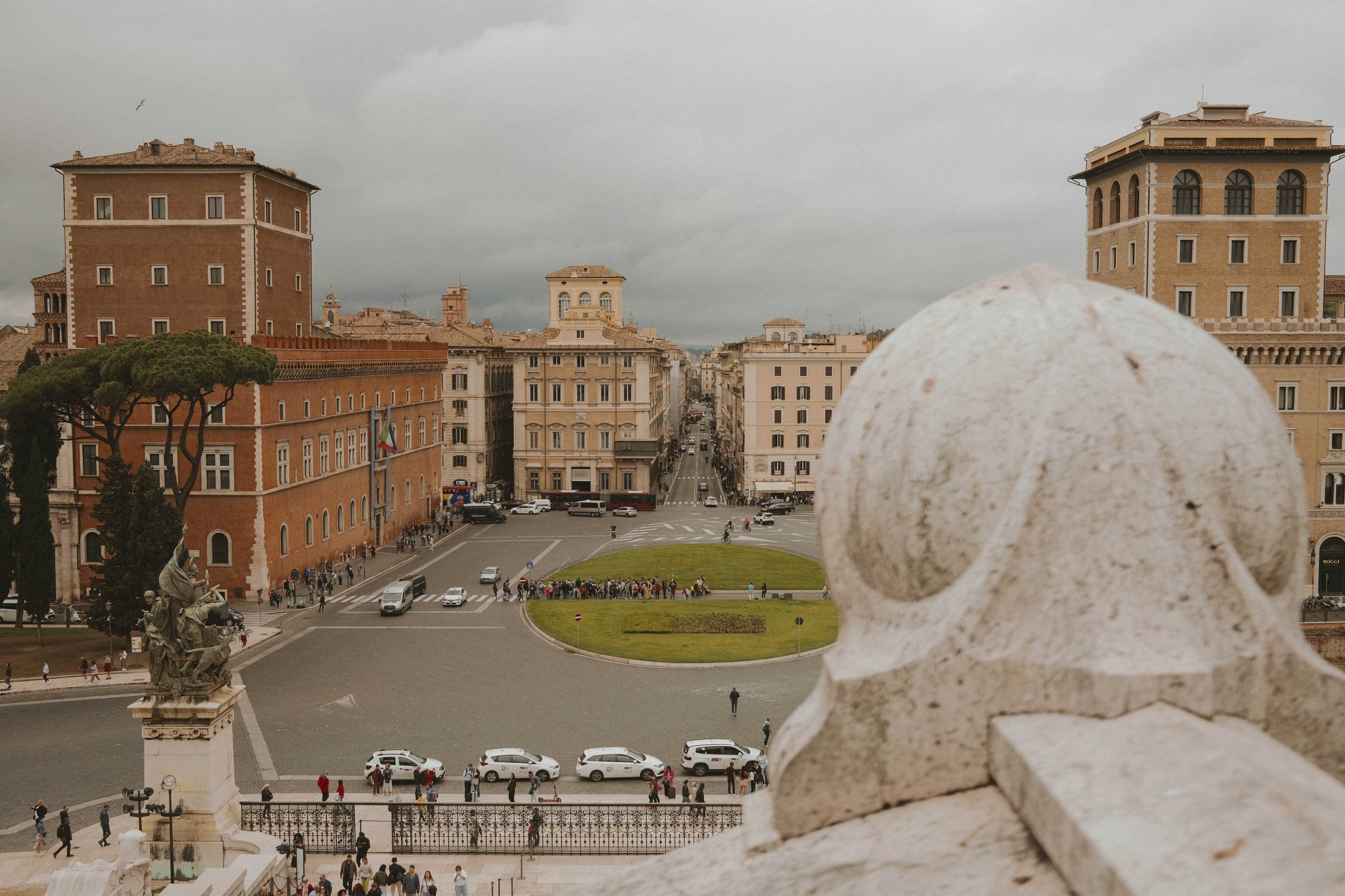 On the Victor Emmanuel II Monument, looking towards the city and a long, wide street.