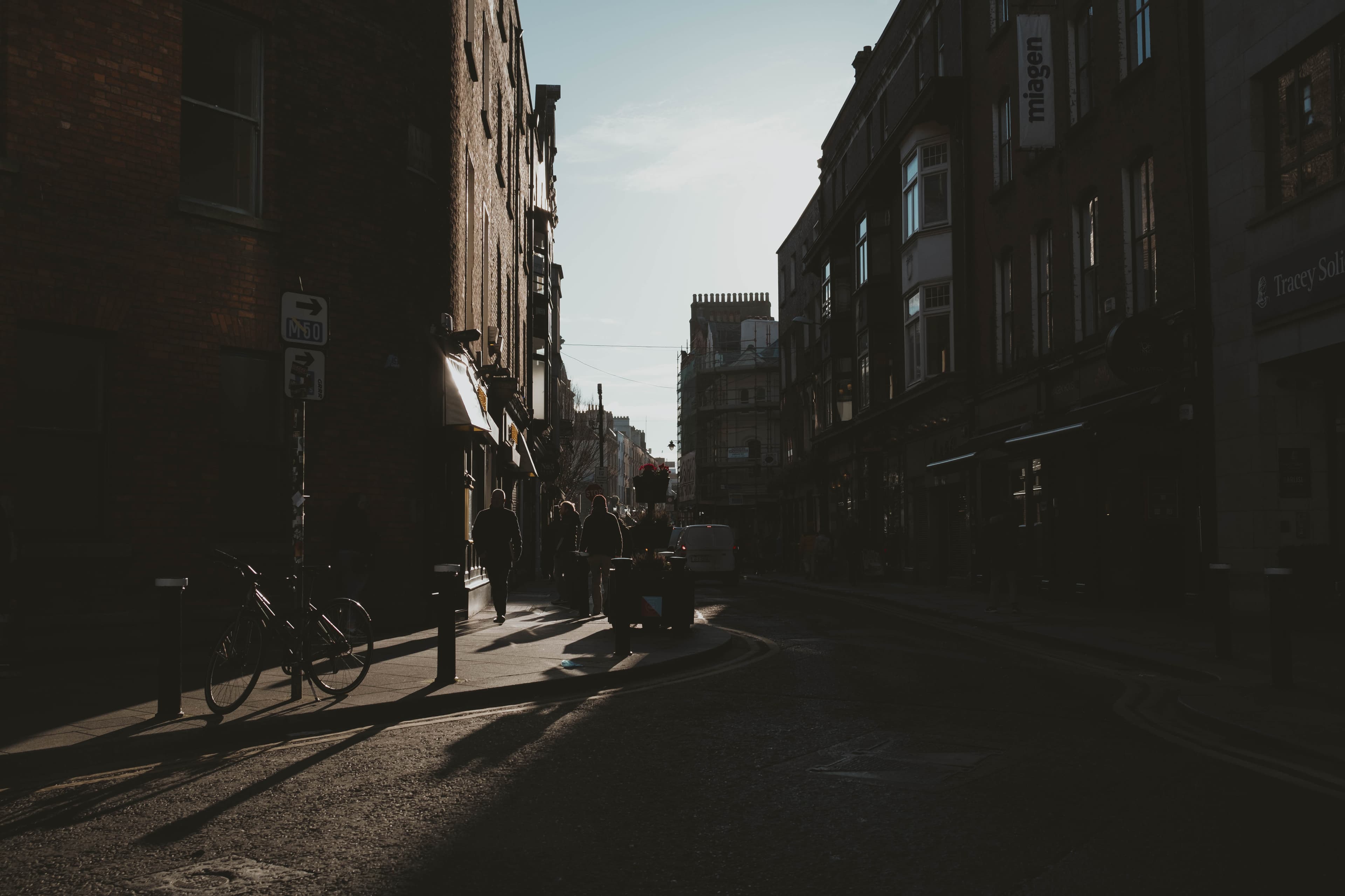 A Dublin street, contrasted with harsh shadows. No people.
