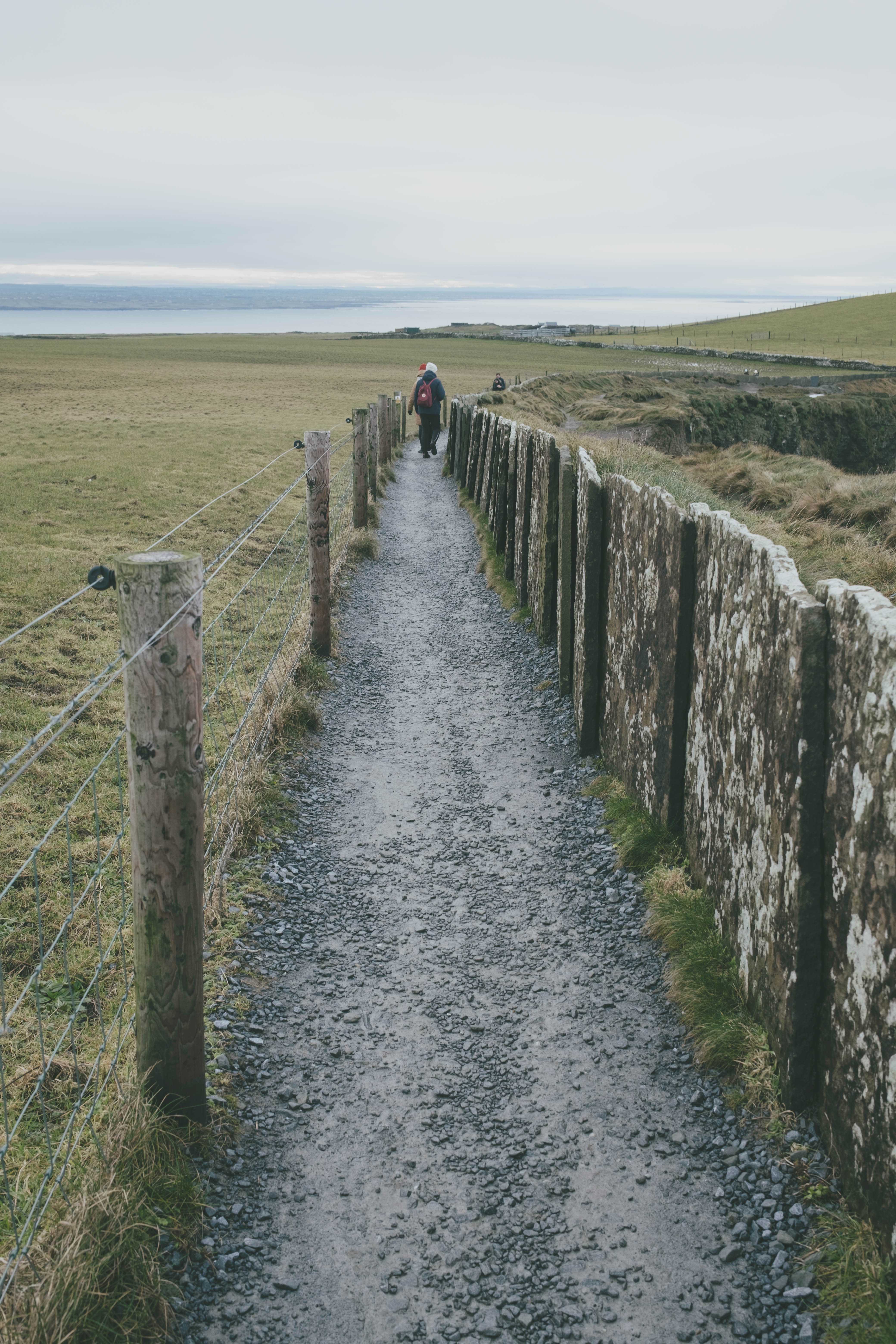 Hiking path with someone walking far ahead