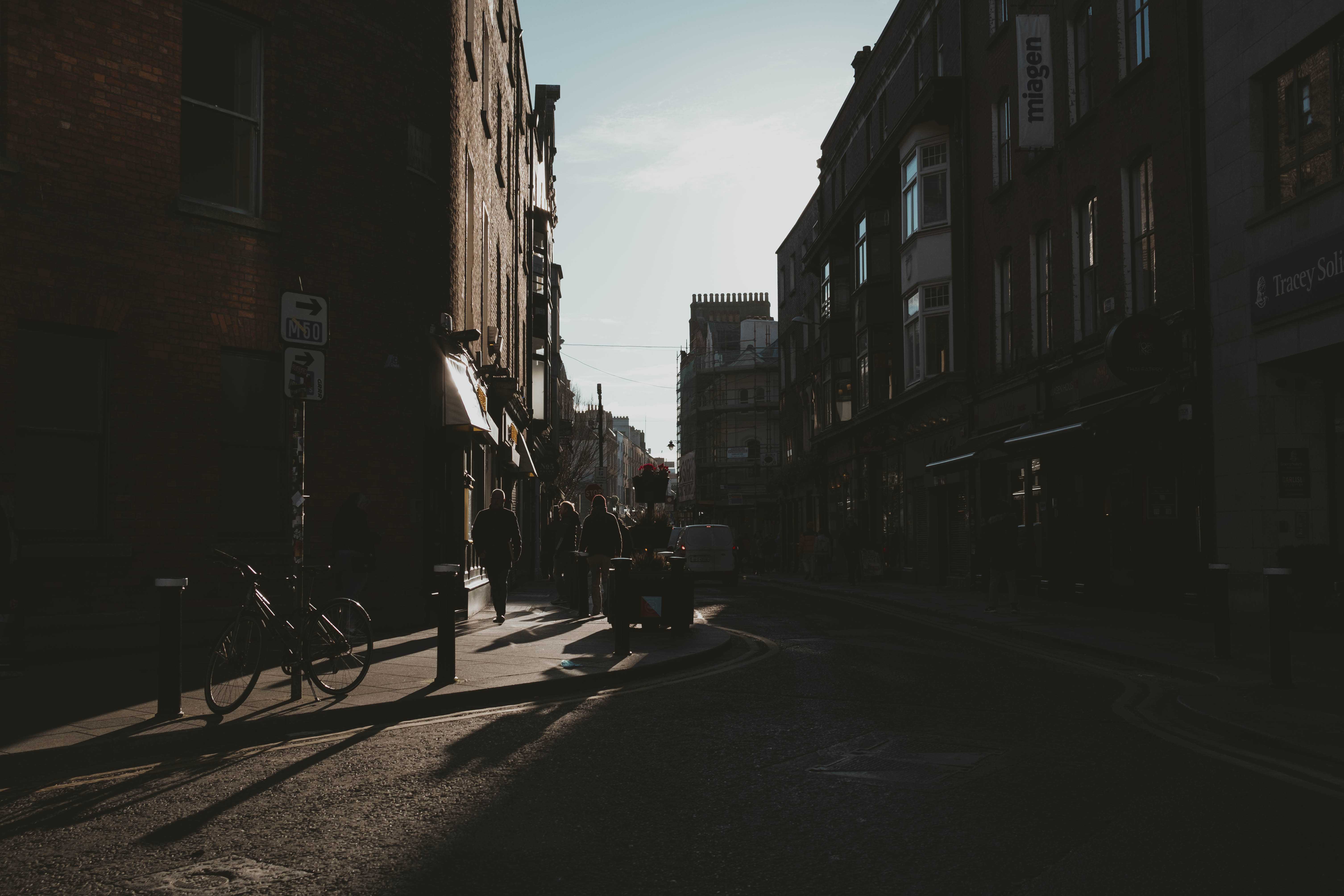 A Dublin street, contrasted with harsh shadows. No people.