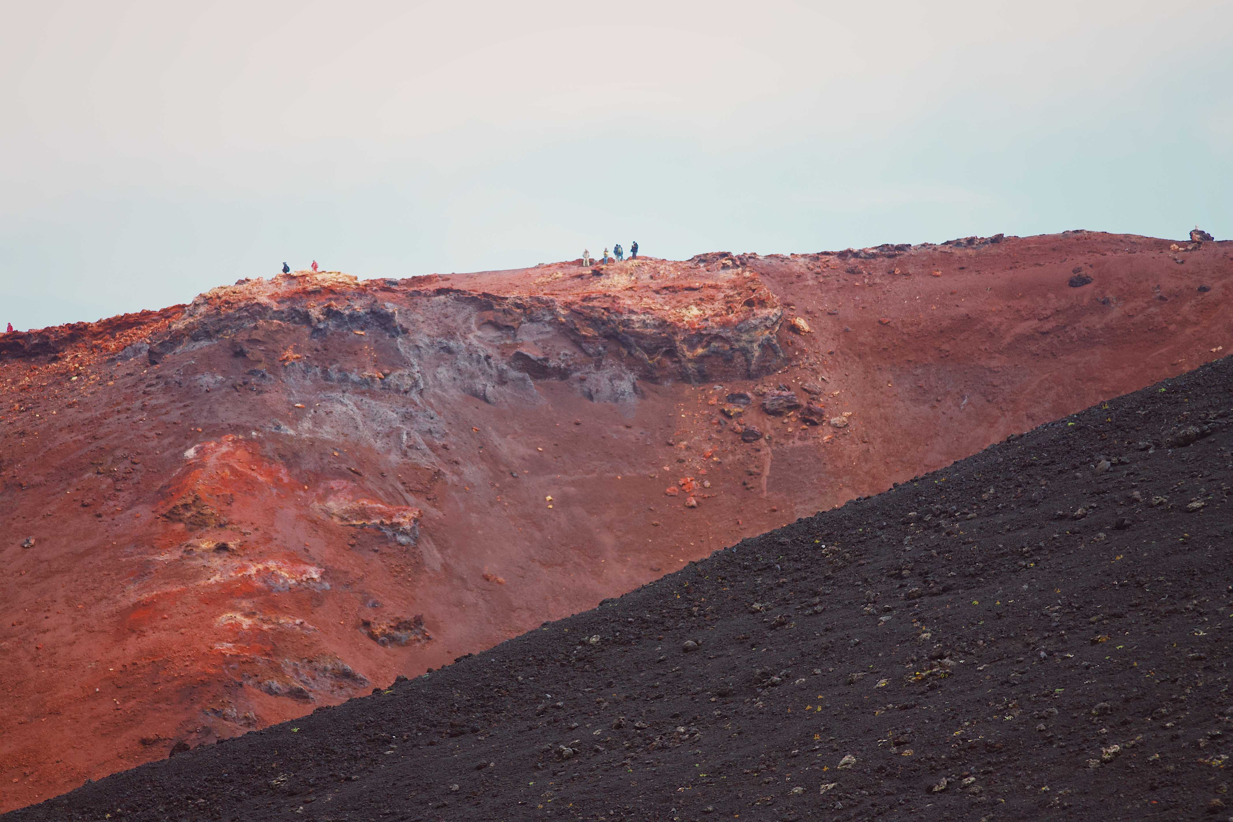 Hikers on top of Eldfell volcano