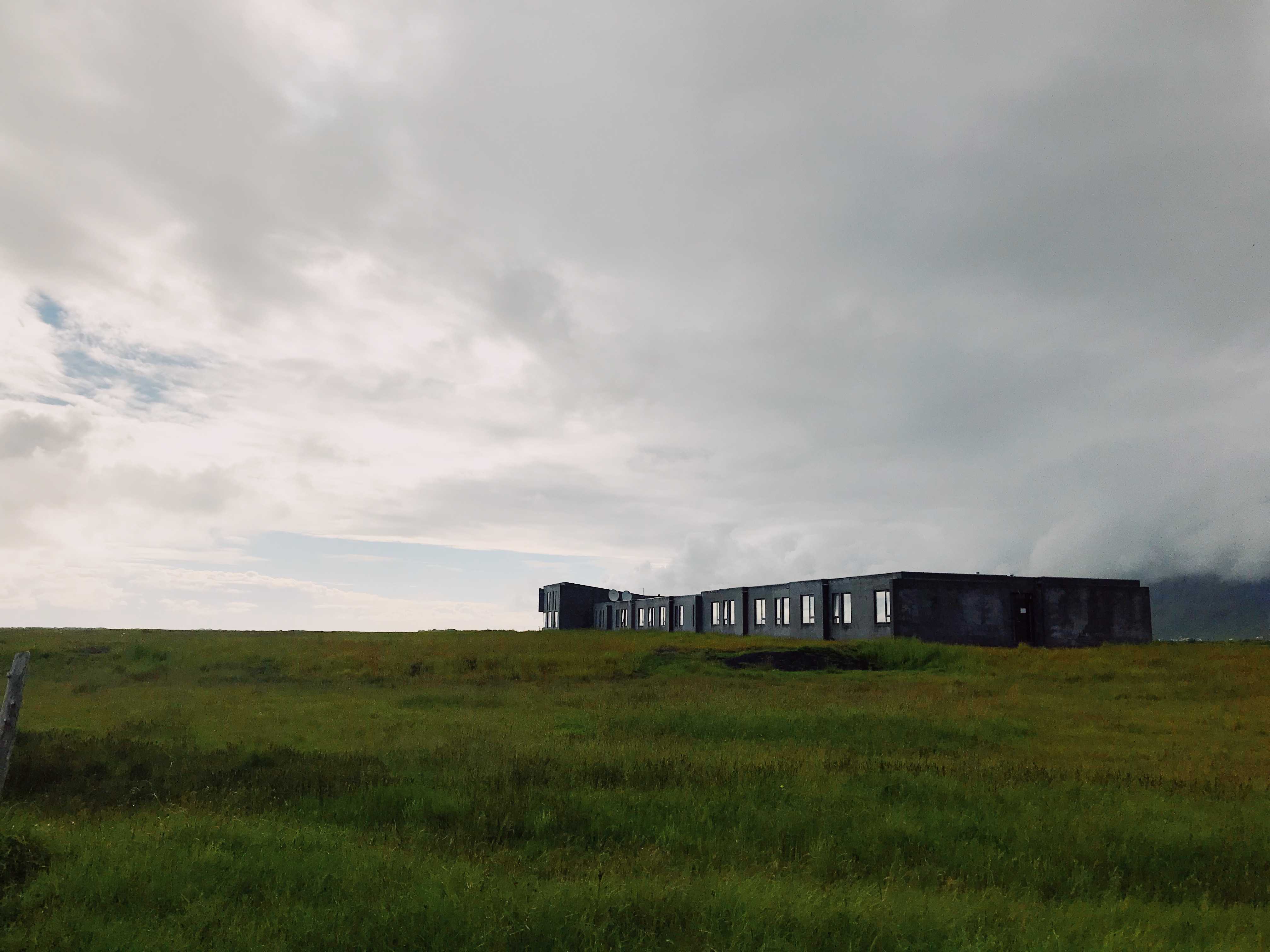 Umi Hotel looking stoic against the grasses