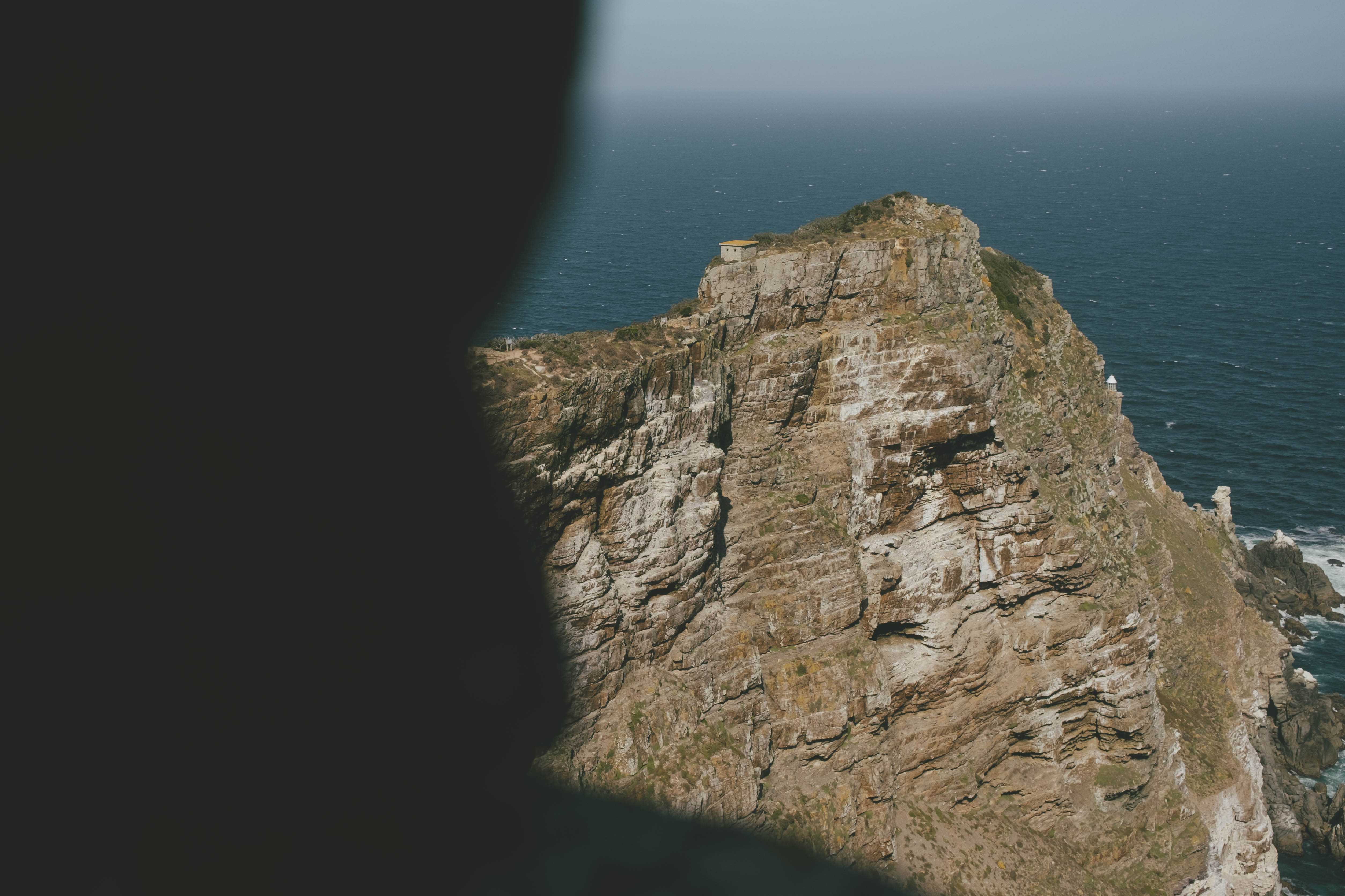 Cape Point, framed by the shadow of a nearby cliff