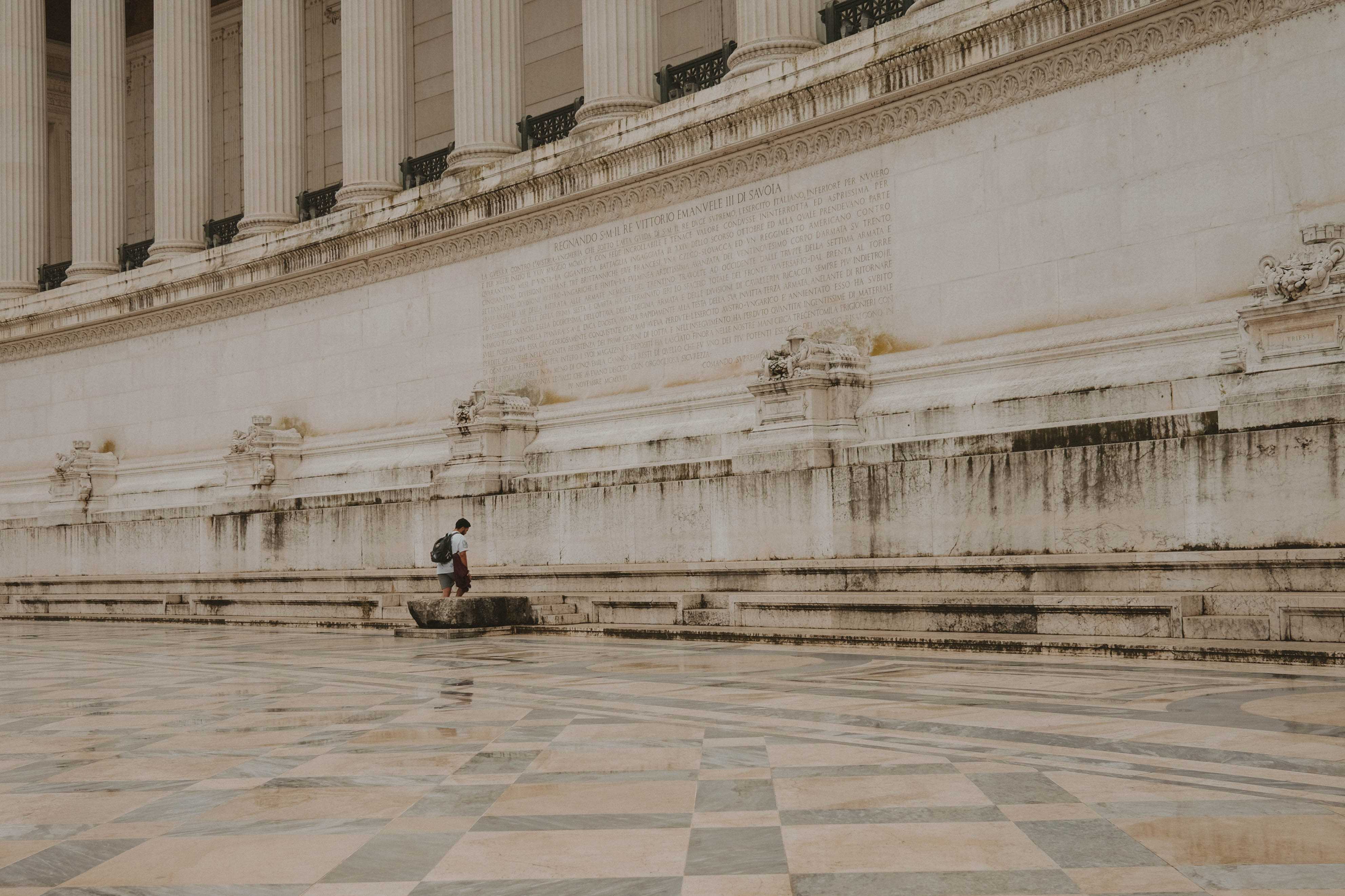 Man reading something on the Victor Emmanuel II Monument