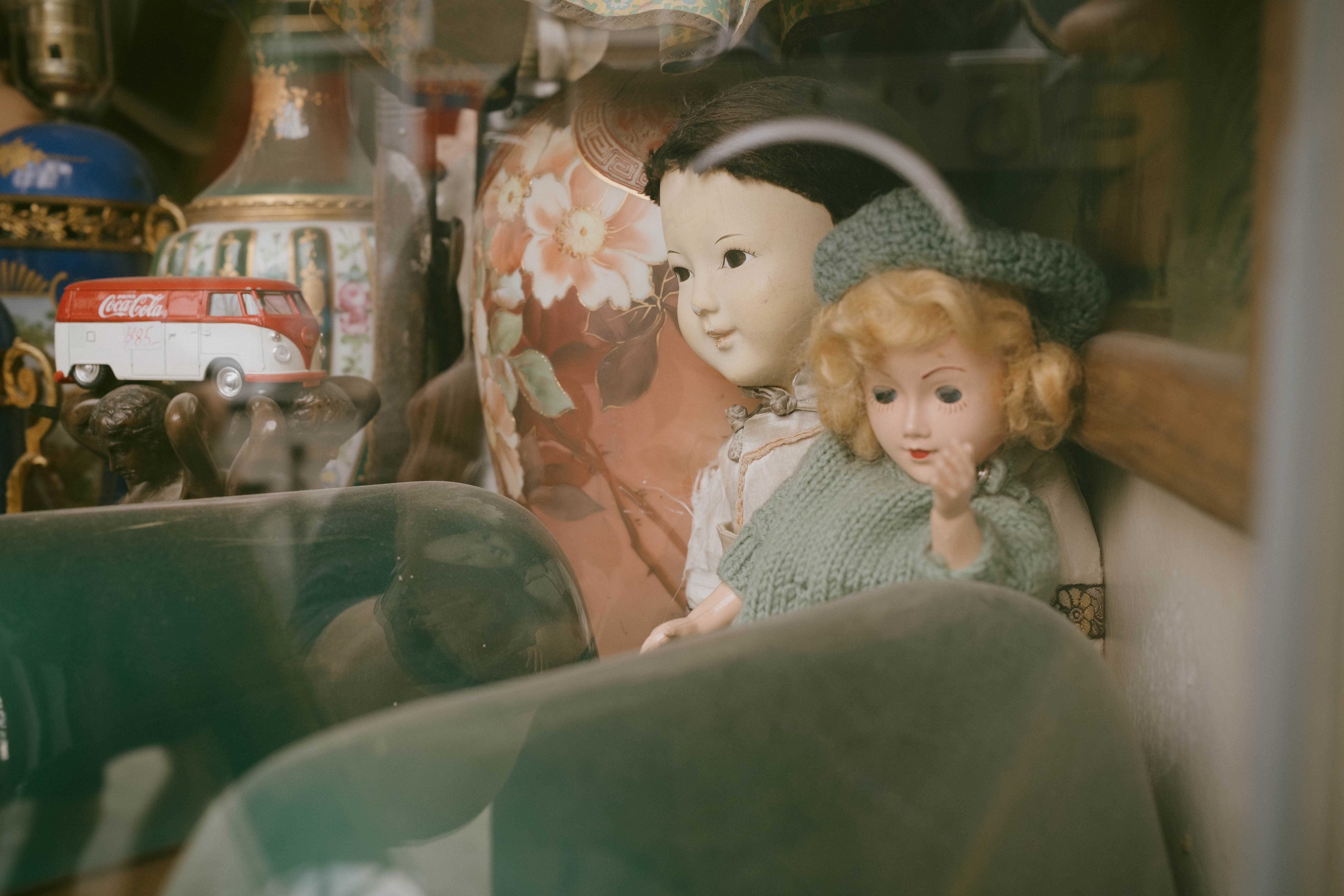 Tight shot of dolls in a storefront